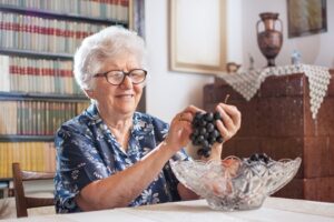 Senior Eating Grapes